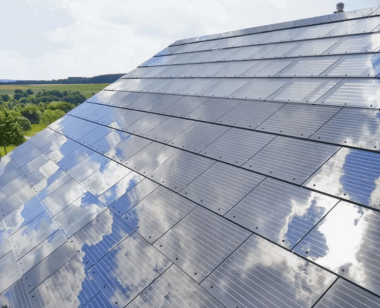 Tesla sunsets its solar roof tiles Tesla Solar Roof glass tiles on a house