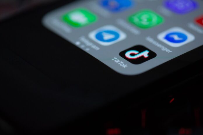 The TikTok app icon on a smartphone home screen